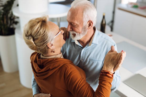 istock Happy senior couple  dancing at home 1315488038