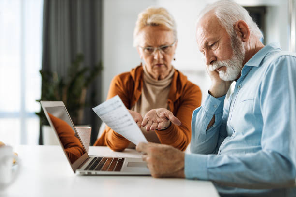 istock Senior couple  having problems with paying their bills 1315489298