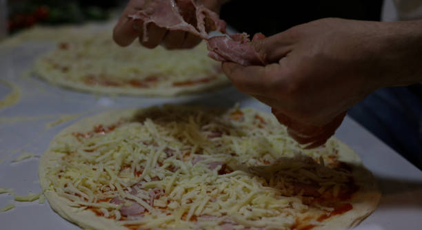 istock A chef preparing  pizza. Stock photo 1315490008