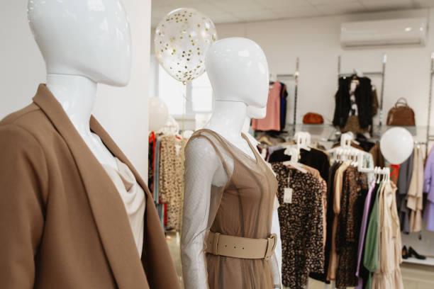 istock Women's clothes on manikin in the showroom. Copyspace 1315495449