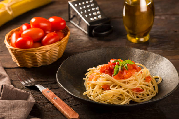 istock Dish with spaghetti in tomato sauce and basil. 1315499380