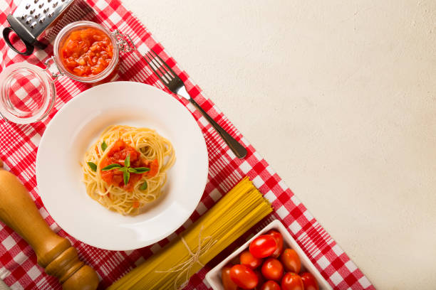 istock Dish with spaghetti in tomato sauce and basil. 1315499416