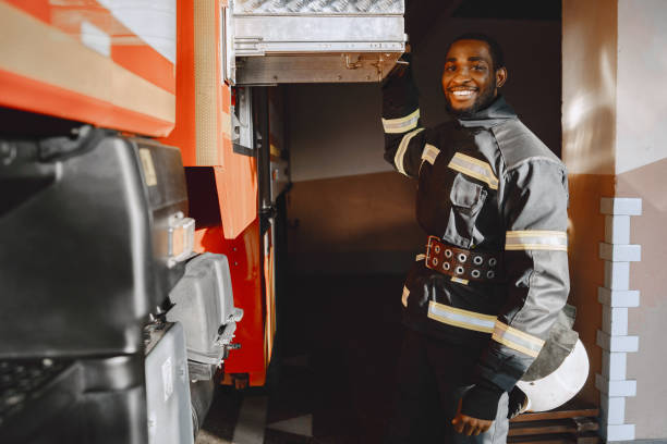 istock Portrait of a firefighter standing in front of a fire engine 1315502416
