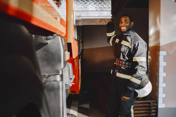 istock Portrait of a firefighter standing in front of a fire engine 1315502429