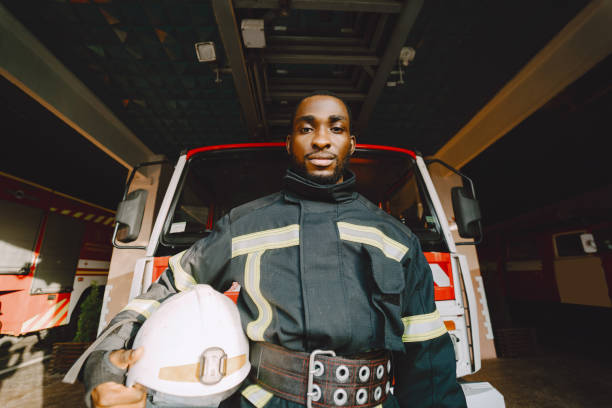 istock Portrait of a firefighter standing in front of a fire engine 1315502441