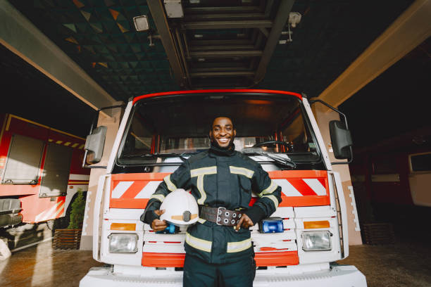 istock Portrait of a firefighter standing in front of a fire engine 1315502449