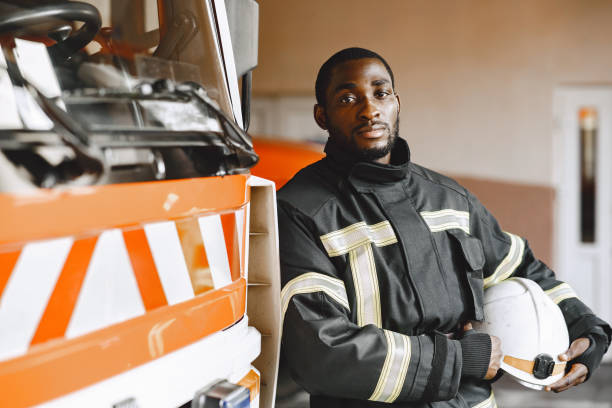 istock Portrait of a firefighter standing in front of a fire engine 1315502450