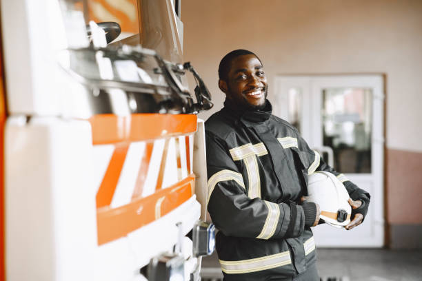 istock Portrait of a firefighter standing in front of a fire engine 1315502453