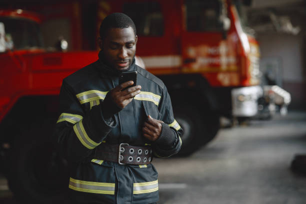 istock Portrait of a firefighter standing in front of a fire engine 1315502468