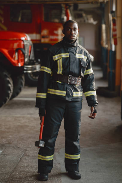istock Portrait of a firefighter standing in front of a fire engine 1315502469