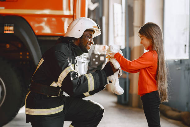 istock Portrait of a firefighter standing in front of a fire engine 1315502491