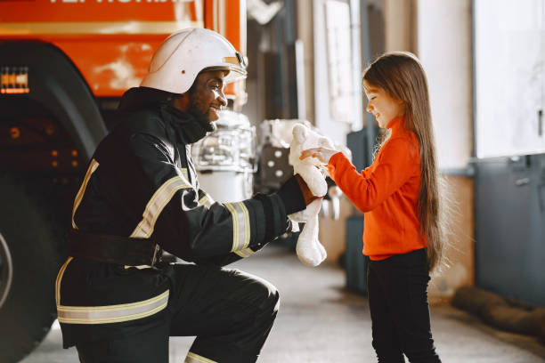 istock Portrait of a firefighter standing in front of a fire engine 1315502504