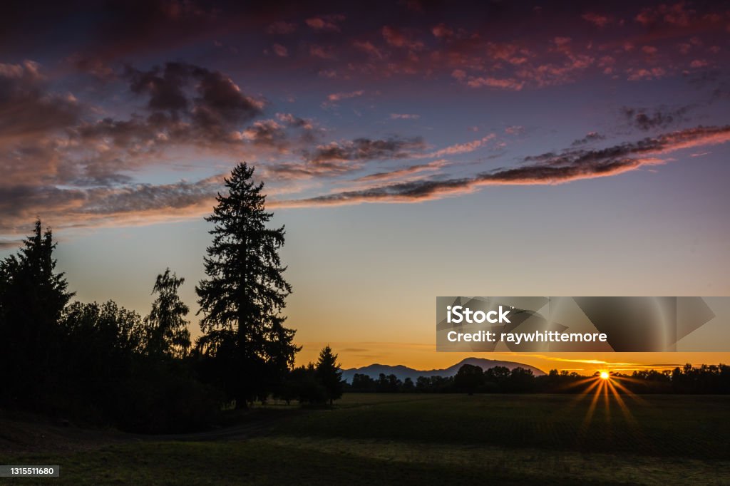 Mary's Peak Sunburst A sunset near Mary's Peak in Willamette Valley Oregon - US State Stock Photo