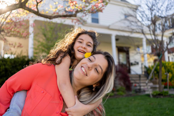 istock Young daughter hugging her mother outdoors during springtime 1315511803