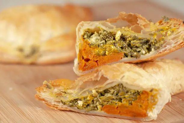 Freshly baked spinach triangle pastry with danish feta and roaster pumpkin.