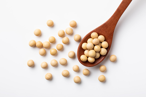 Soybeans on wooden spoon