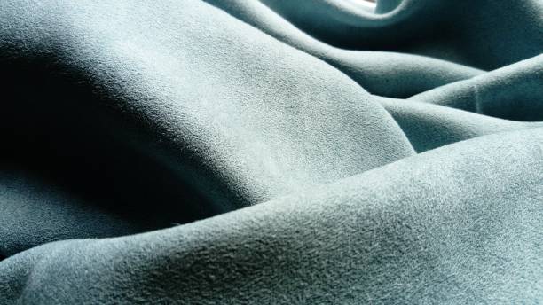 The fabric is gray velvet laid by the waves. Close-up. stock photo
