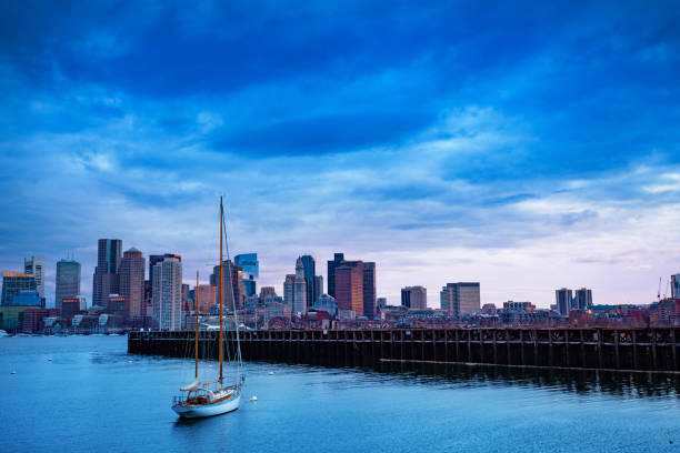 istock Sail boat over Boston downtown and harbor view 1315538077