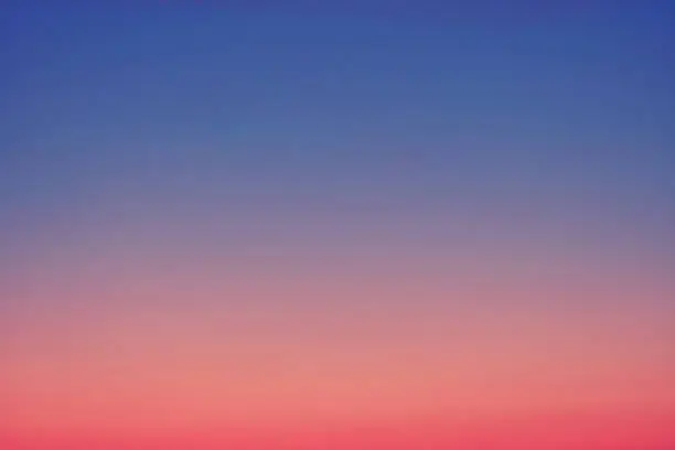 Photo of Gradient evening sky with colors from blue to red