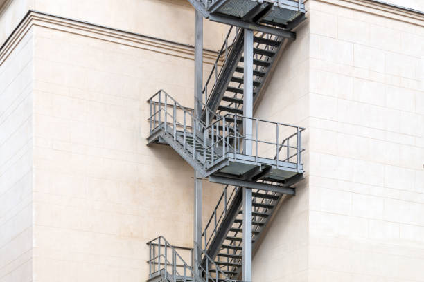 istock A gray metal staircase on a white marble building. 1315545854