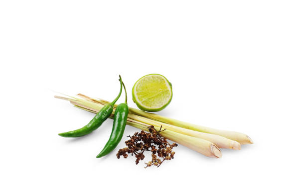 istock Ingradients of Tom Yum Kung isolated on white background with clipping path. Herbs for making Thai food such as green chili, lime, lemon grass, and spice. 1315547842