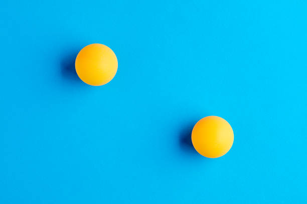 istock Two orange table tennis balls opposed to each other 1315549678
