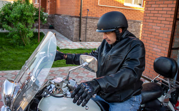 istock Motorcycle man in jacket and helmet, biker 1315550154
