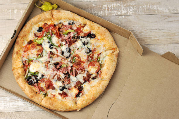 istock pizza with meat and tomatoes 1315553887