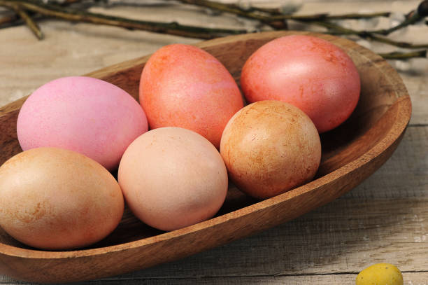 istock painted easter eggs in a wooden plate 1315553987
