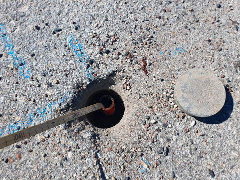 Measuring of groundwater level in a pipe under asphalt level