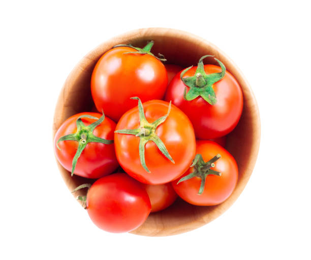 istock Fresh red tomatoes in wood bowl isolated on white background 1315554603