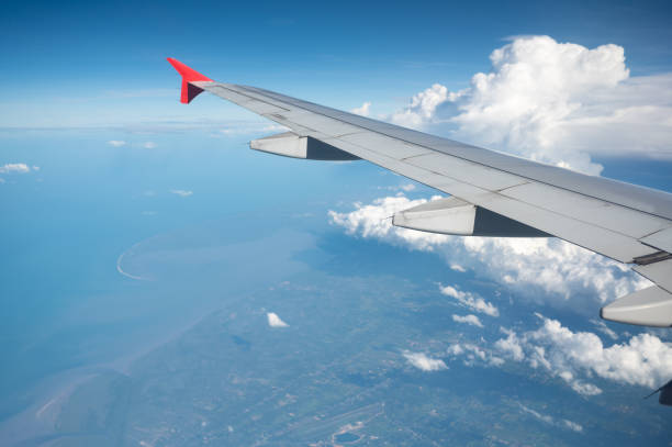 istock Passenger jet airplane moving though the cloud in suuny day 1315560777