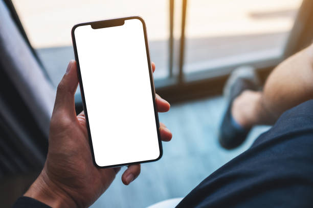 istock a man holding mobile phone with blank white screen in cafe 1315570969