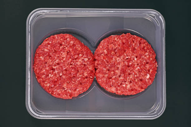 istock Raw round burger patties in package 1315581936
