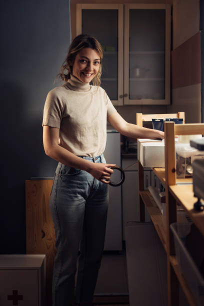 istock Moving House: Happy Woman Packing Things in Her Kitchen 1315582708