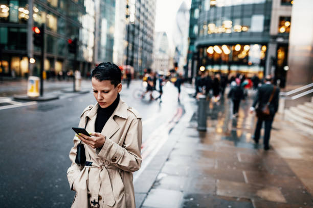 istock Commuter in London using mobile phone 1315588526