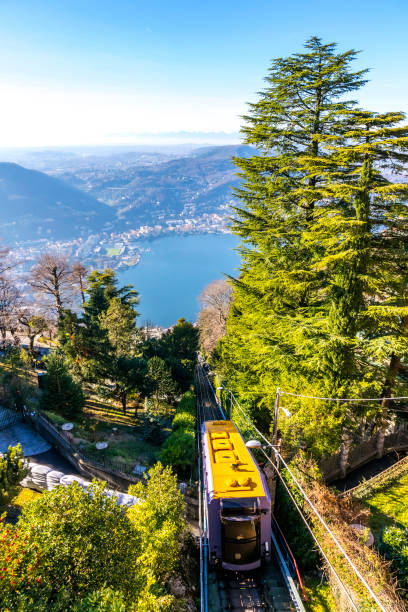 Como–Brunate funicular in Como, Lombardy, Italy Como–Brunate funicular is a funicular railway that connects the city of Como with the village of Brunate in Lombardy, Italy. Operated since 1894. Como Lake on background como italy stock pictures, royalty-free photos & images