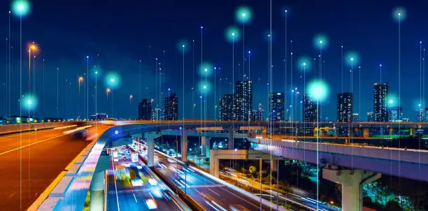 Photo of Modern cityscape and communication network concept. Telecommunication. IoT (Internet of Things). ICT (Information communication Technology). 5G. Smart city. Digital transformation.