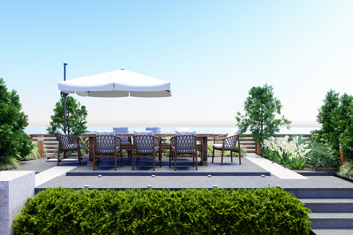 Villa Terrace Or Luxury Hotel Terrace With Dining Table , Chairs , Trees And Seaview Background