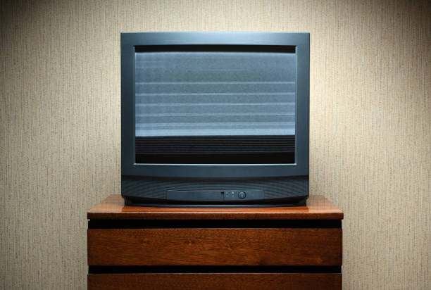 istock Old TV with clutter on the screen on an old table, vintage design in 80s and 90s style. 1315600067