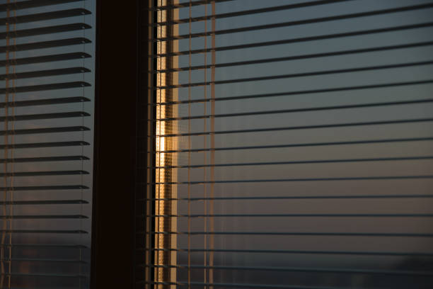 istock The sun shines through the blinds. 1315600475