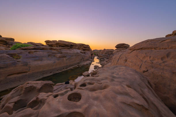 istock Sam Phan Bok, Ubon Ratchathani, Thailand. Dry rock reef in the Mekong River with mountain hills. Nature landscape background. Grand Canyon of Thailand. 1315602202