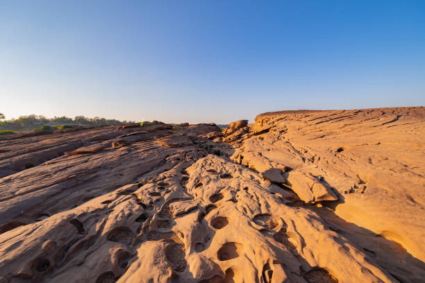 istock Sam Phan Bok, Ubon Ratchathani, Thailand. Dry rock reef in the Mekong River with mountain hills. Nature landscape background. Grand Canyon of Thailand. 1315602809