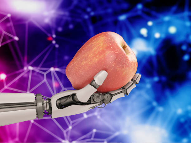istock Industrial Robotic Hand Holding Apple 1315604637