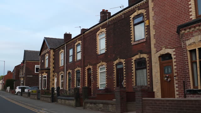 Red brick houses on the main road in Hindley