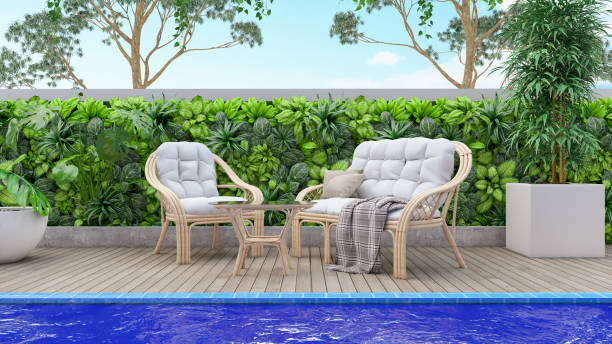 istock Relaxing Chairs with Pillows Beside Swimming Pool 1315612859