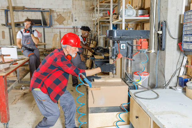 istock Multi-Ethnic Group of Carpenters is Working in a Spacious Manufacture Workshop. 1315615274