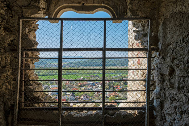View through a barred window, Beckov, Slovak republic, Europe. Travel destination.