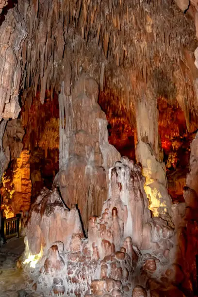 Photo of Stalactites and stalagmites in Damlatas cave in Alanya (Turkey), vertical