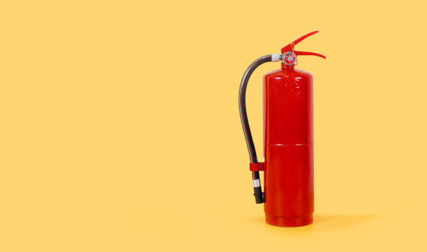 istock Fire extinguisher on yellow color background 1315621926